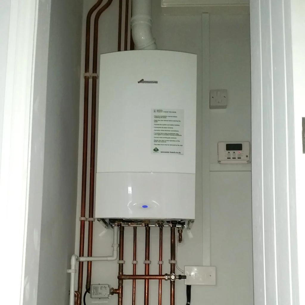 A new boiler installation in a cupboard